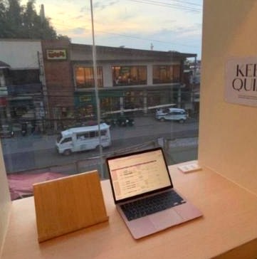 Quiet window desk with laptop